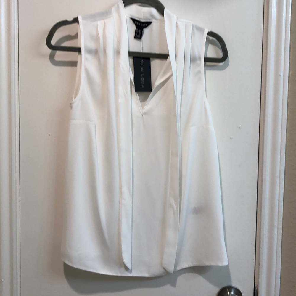 White chiffon blouse with tie detail. New with tag